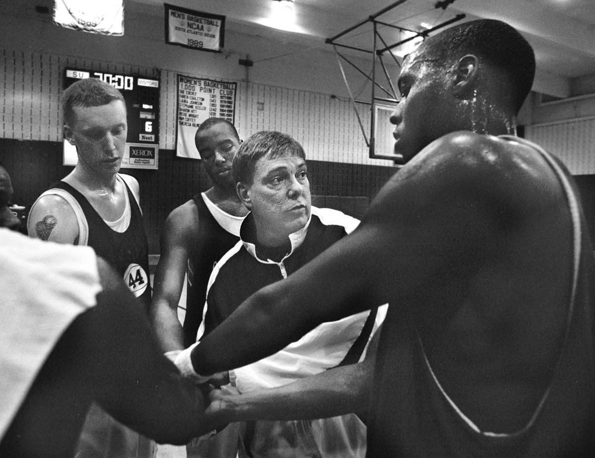 Dave Dutton in a huddle with his Shenandoah University players